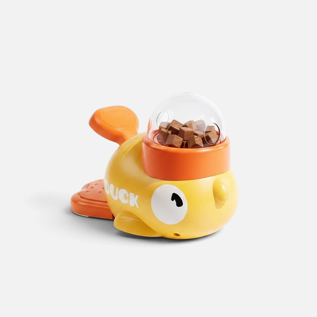 Tailora interactive duck-shaped treat dispenser toy in yellow and orange with a clear dome for dry food