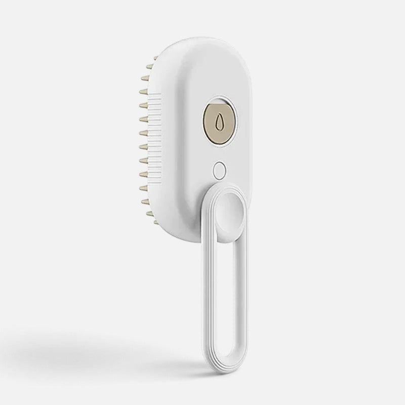 Tailora 3-in-1 steamy spray grooming brush in white with a gold button and hanging loop for pet deshedding