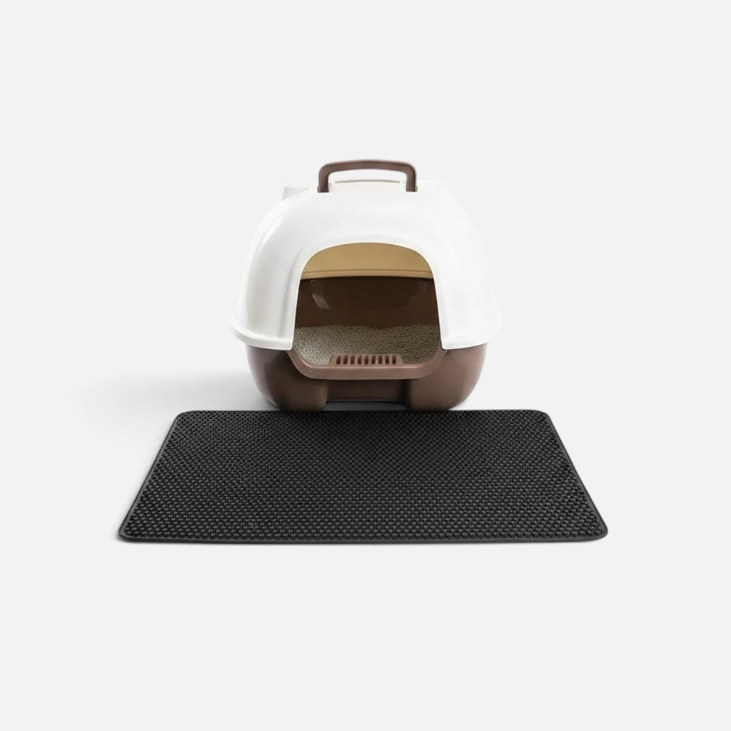 Tailora black double-layer honeycomb litter mat placed in front of a white and brown hooded cat litter box