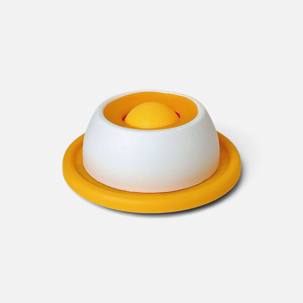 Tailora calming slow feeder mat in white and yellow silicone with a central dome for interactive pet treat licking.