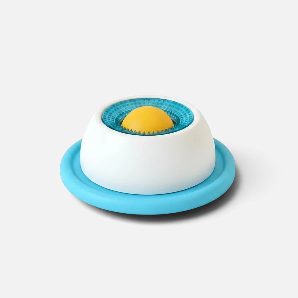 Tailora calming slow feeder mat for pets with a white base, blue textured ring, and yellow center for treats