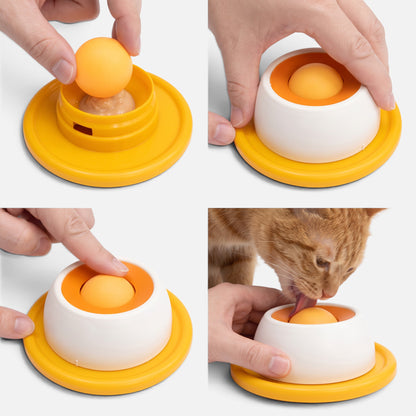 Tailora Calming Slow Feeder Mat with a treat-dispensing ball, showing a cat licking the food-grade silicone toy.