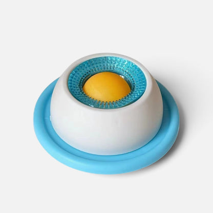 Tailora calming slow feeder mat for pets with a white base, blue textured rim, and yellow center for treats.