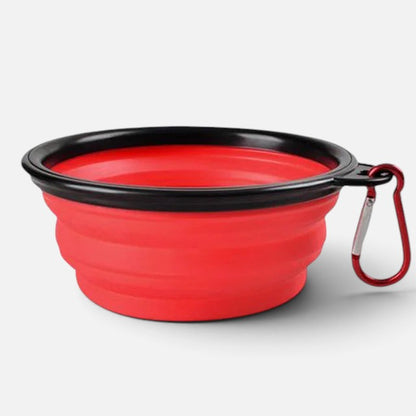 Tailora collapsible red silicone pet travel bowl with a black rim and attached metal carabiner clip for easy carrying.