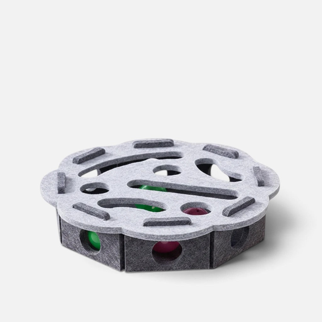 Tailora grey felt interactive cat puzzle box with peek-a-boo cutouts and colorful balls for hunting play