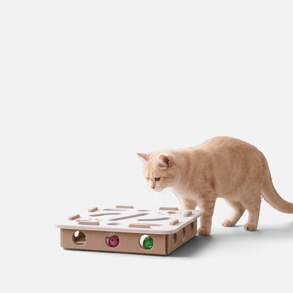 Tailora interactive felt cat puzzle box with peek-a-boo holes and toy balls, featuring a beige cat playing.