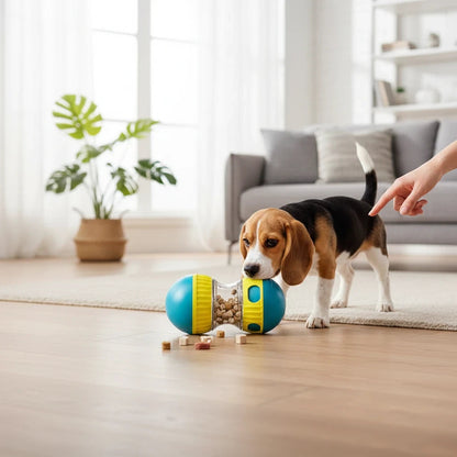 Tailora interactive pet treat dispenser toy in blue and yellow being used by a beagle puppy on a living room floor