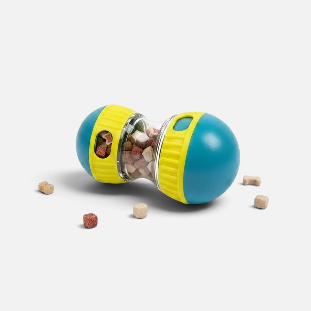 Tailora interactive pet treat dispenser toy in blue and yellow with dry food inside on a light grey background