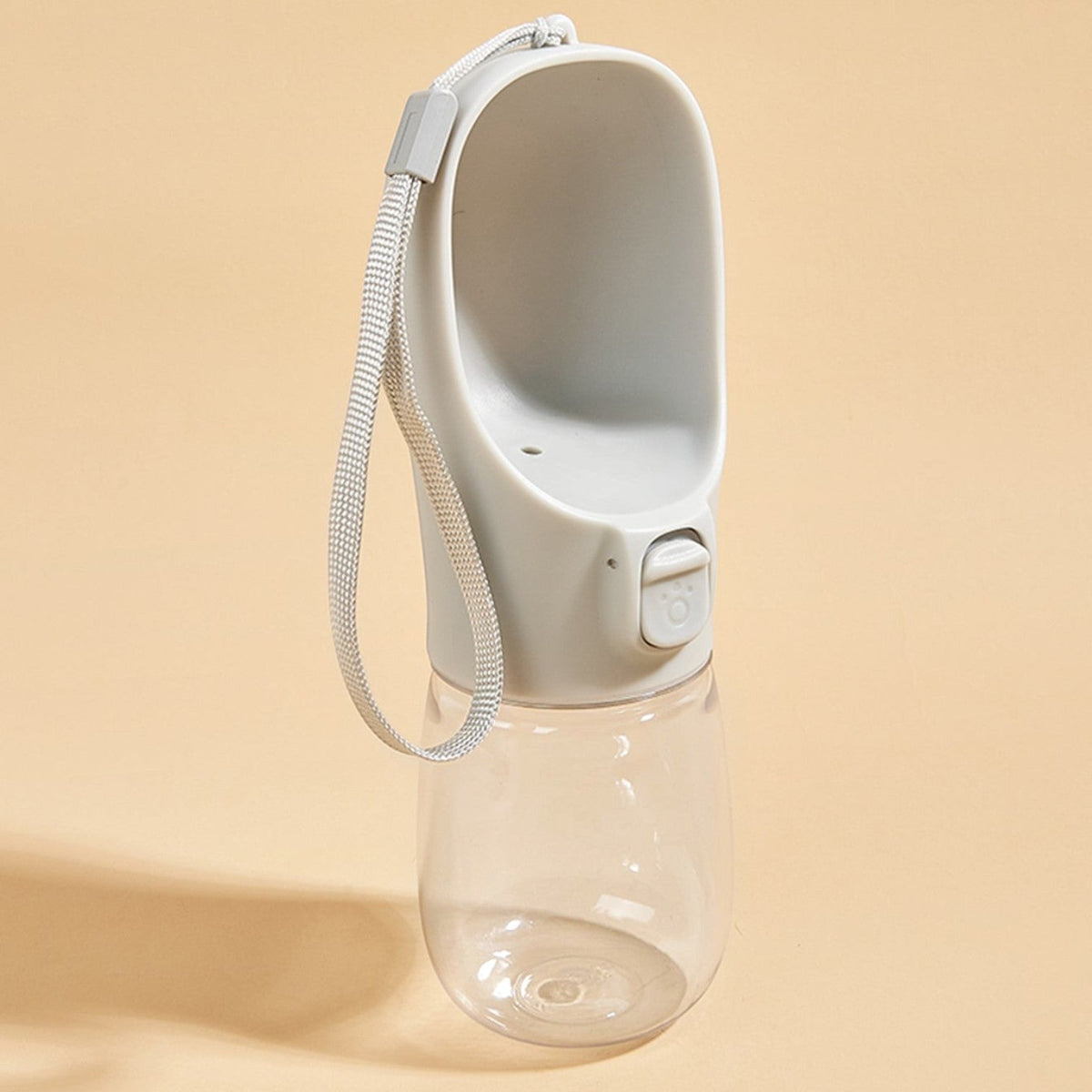 Tailora leak-proof portable dog water bottle with a grey drinking trough, lock button, and carrying lanyard.