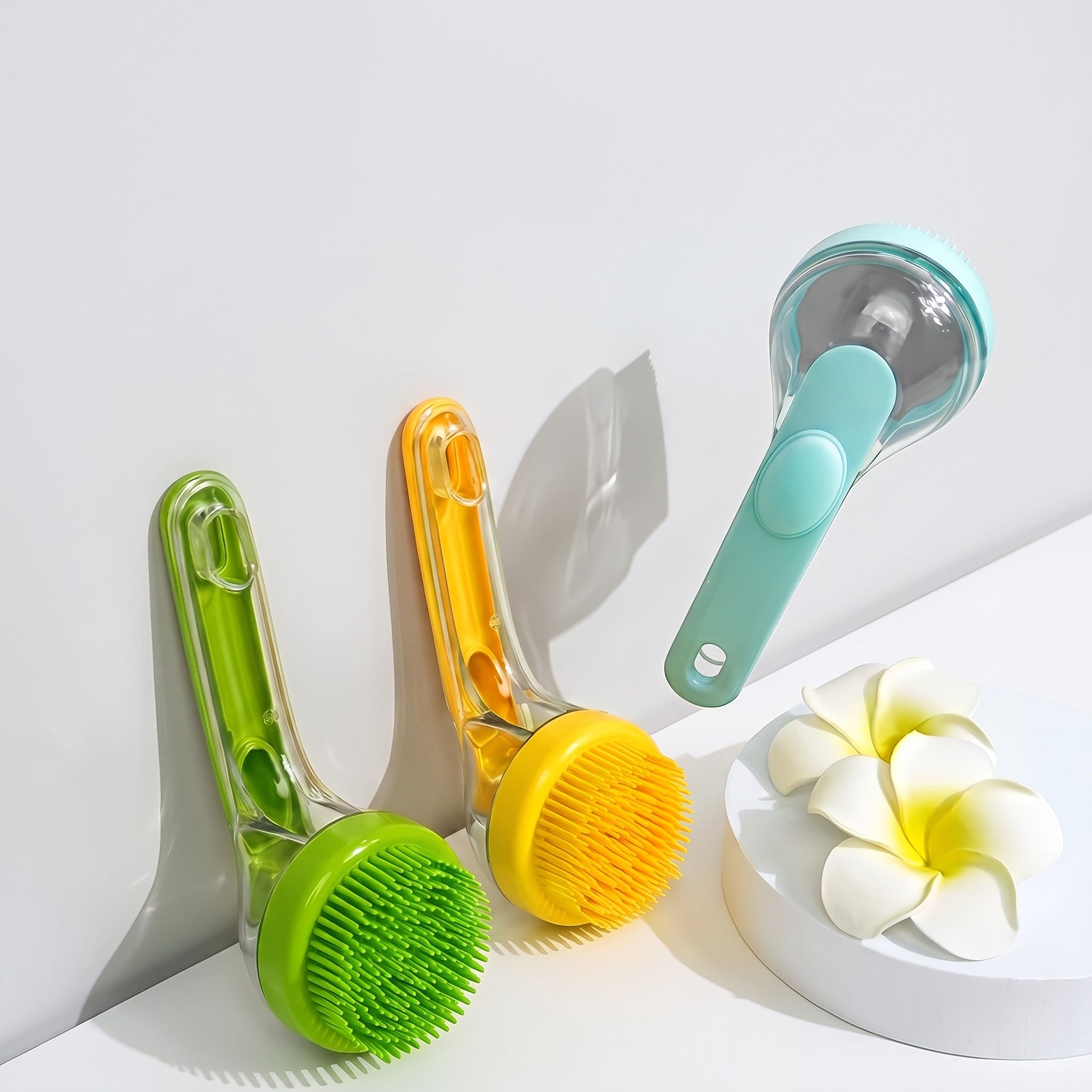 Tailora 2-in-1 pet bath brushes in green, yellow, and blue with soft silicone bristles and ergonomic handles