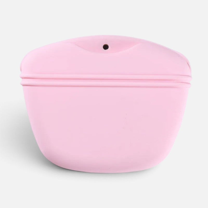 Tailora pink silicone dog treat pouch with a magnetic closure and integrated waste bag dispenser port.