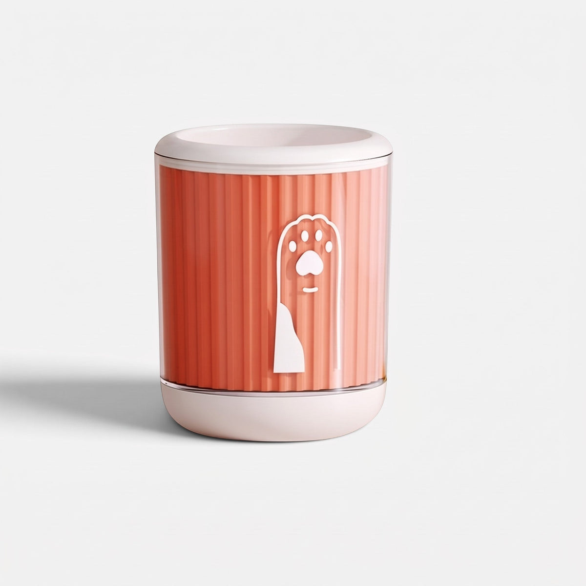 Tailora portable paw washer cup in coral orange with a white paw print icon and soft silicone bristles inside