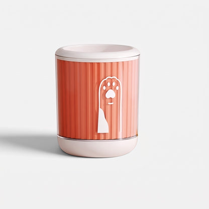 Tailora portable paw washer cup in coral orange with a white paw print icon and soft silicone bristles inside