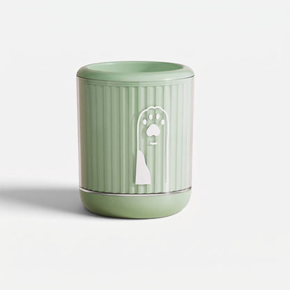 Tailora portable paw washer cup in sage green with a white paw print icon and soft internal silicone bristles