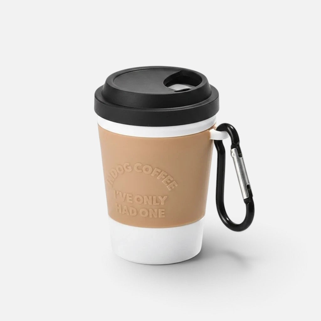 Tailora portable dog poop bag dispenser designed as a tan and white coffee cup with a black lid and leash carabiner