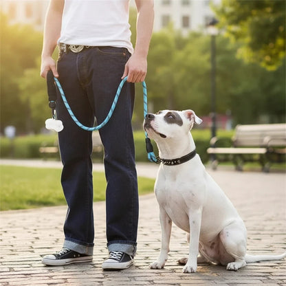 Tailora heavy-duty blue reflective dog leash with padded handle held by a person standing next to a white dog