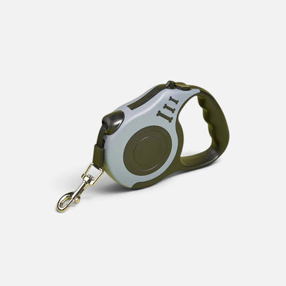 Tailora automatic retractable dog leash in grey and olive green with an ergonomic handle and metal swivel hook