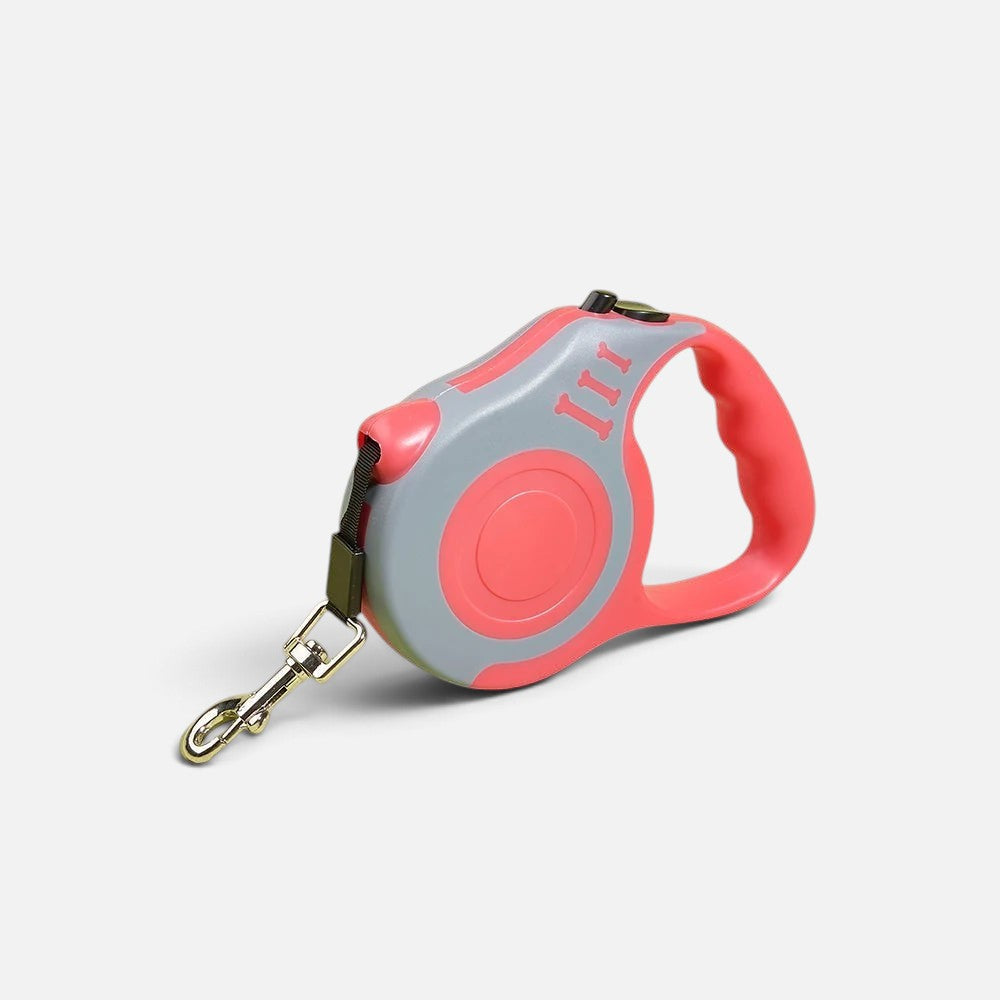 Tailora automatic retractable dog leash in coral pink and grey with an ergonomic handle and metal swivel hook