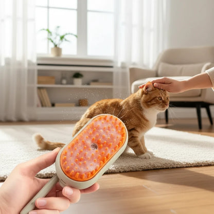 Tailora 3-in-1 steamy spray grooming brush with orange silicone bristles misting a cat for gentle deshedding