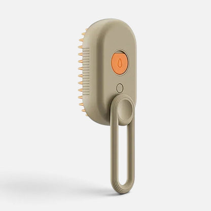 Tailora 3-in-1 steamy spray grooming brush in beige with orange button and soft silicone bristles for pet deshedding