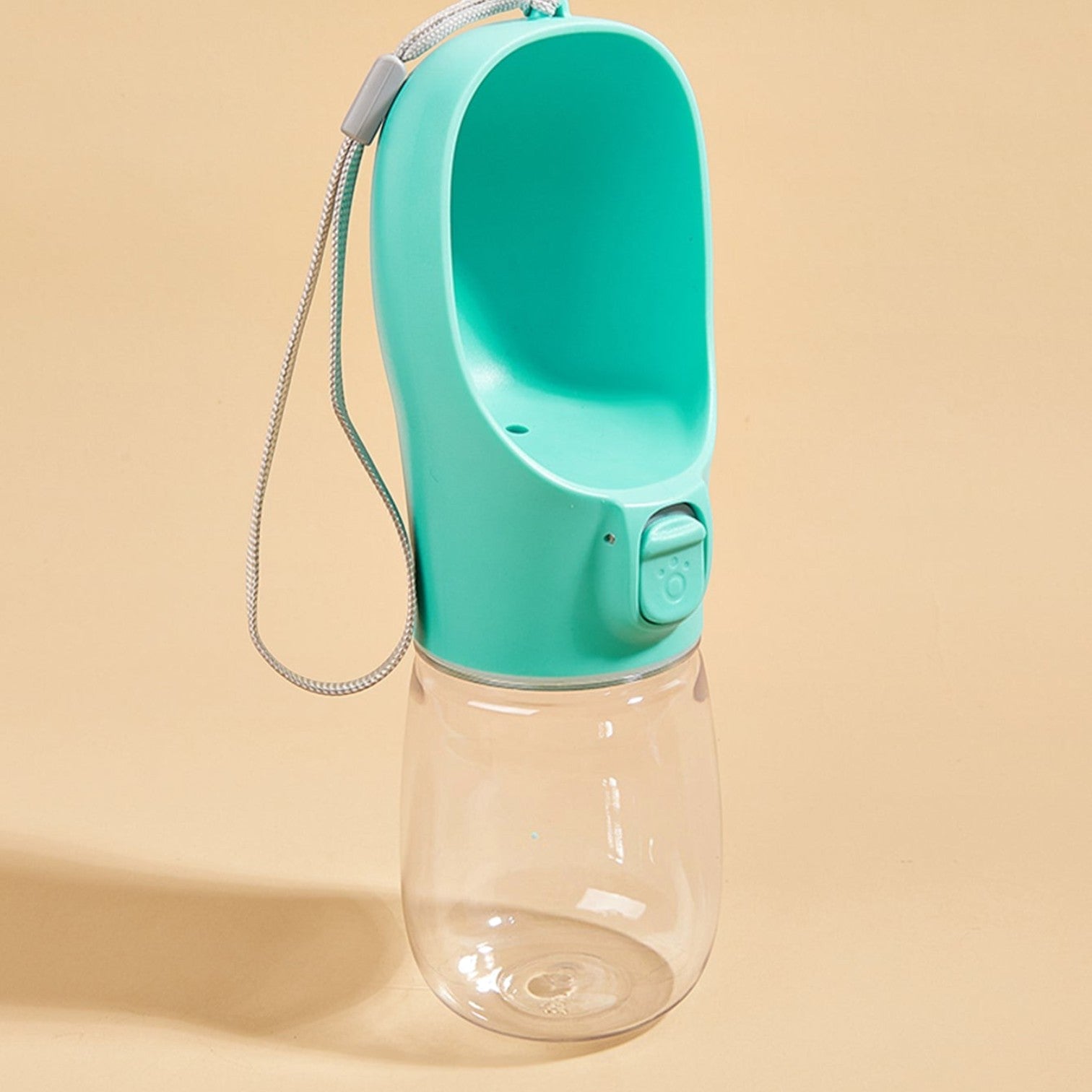 Tailora teal portable leak-proof dog water bottle with a built-in drinking trough and carrying lanyard.