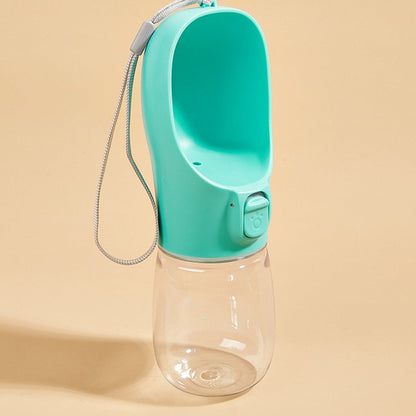 Tailora teal portable leak-proof dog water bottle with a built-in drinking trough and carrying lanyard.