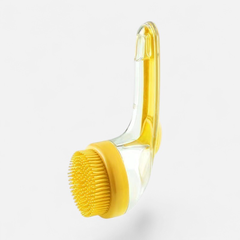 Tailora 2-in-1 pet bath brush with yellow silicone bristles and a clear ergonomic handle for grooming dogs and cats.